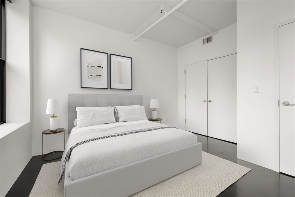 453 Washington Street, Unit 11B Boston, MA 02111 - Photo 21 of 30 a bedroom with a bed and a window