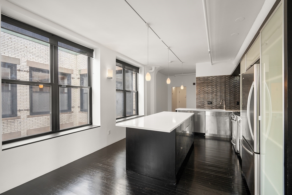 453 Washington Street, Unit 11B Boston, MA 02111 - Photo 22 of 30 a large kitchen with a large window