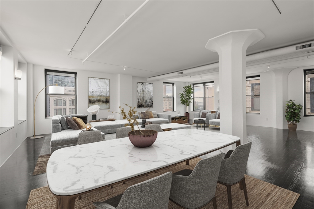 453 Washington Street, Unit 11B Boston, MA 02111 - Photo 4 of 30 a view of a dining room with furniture and wooden floor