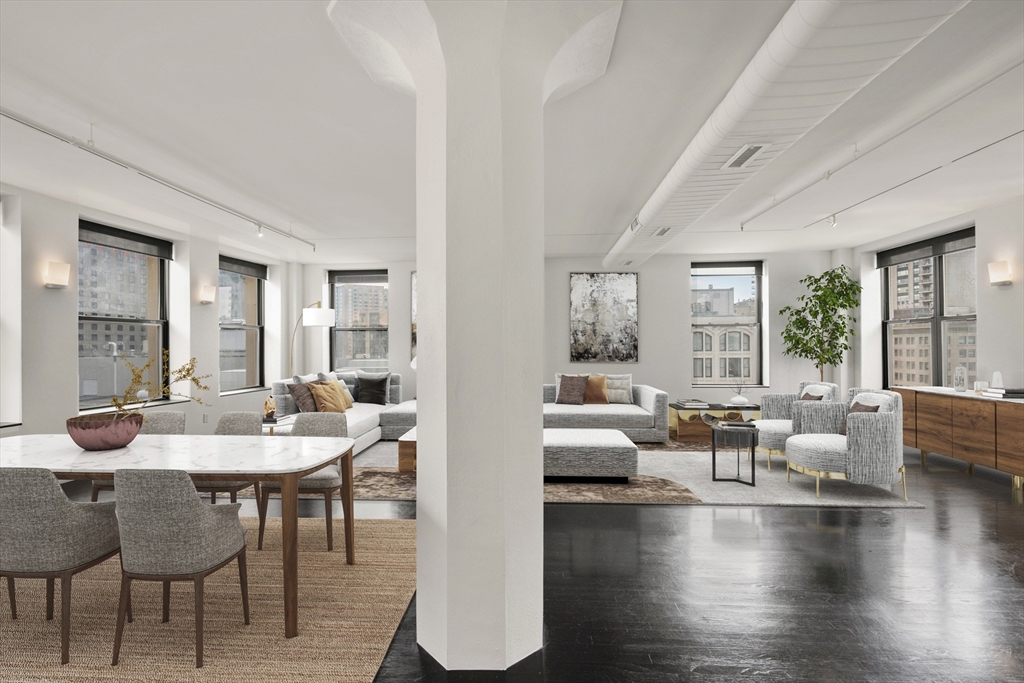 453 Washington Street, Unit 11B Boston, MA 02111 - Photo 7 of 30 a view of a dining room with furniture window and wooden floor