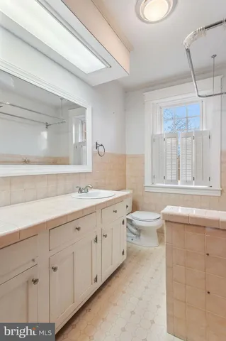 a bathroom with a sink a toilet and a bathtub