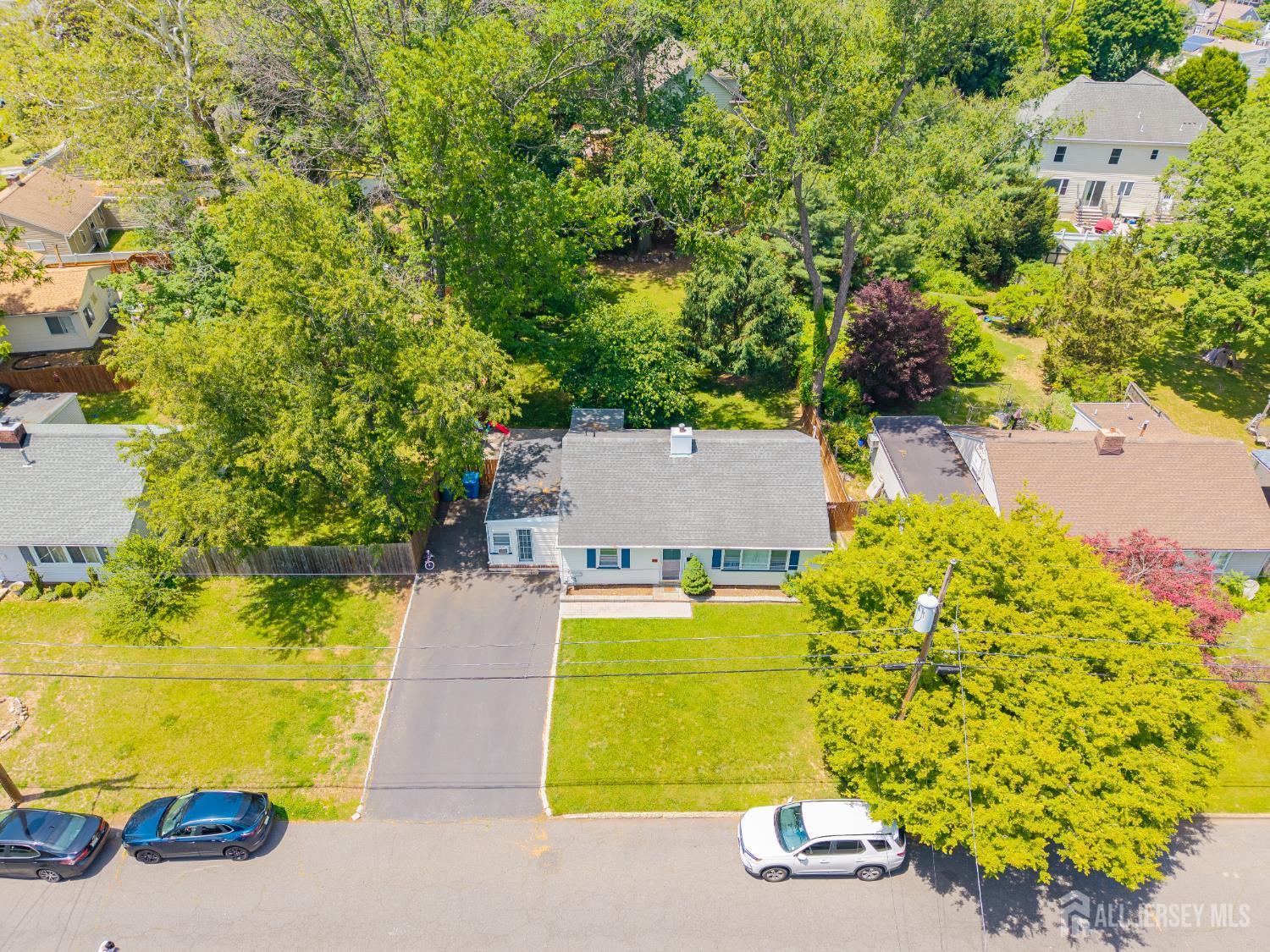 12 Pierrepont Avenue Middlesex, NJ 08846 - Photo 24 of 30 an aerial view of a house with swimming pool and large trees