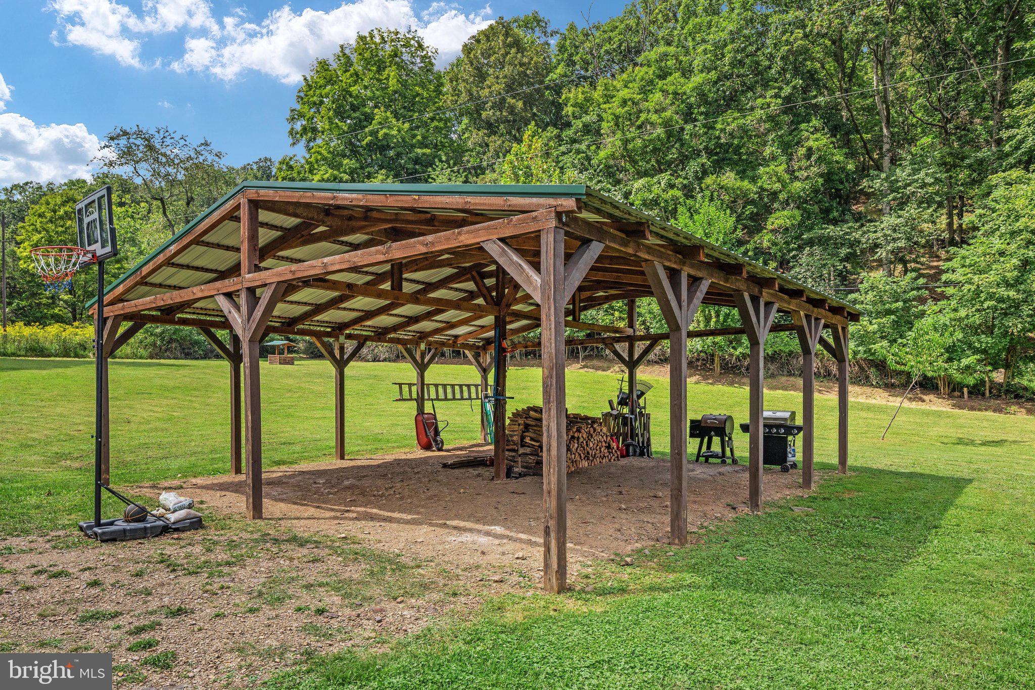 1396 Cullers Run Road Mathias, WV 26812 - Photo 45 of 79 Spacious outdoor shelter amidst lush greenery.