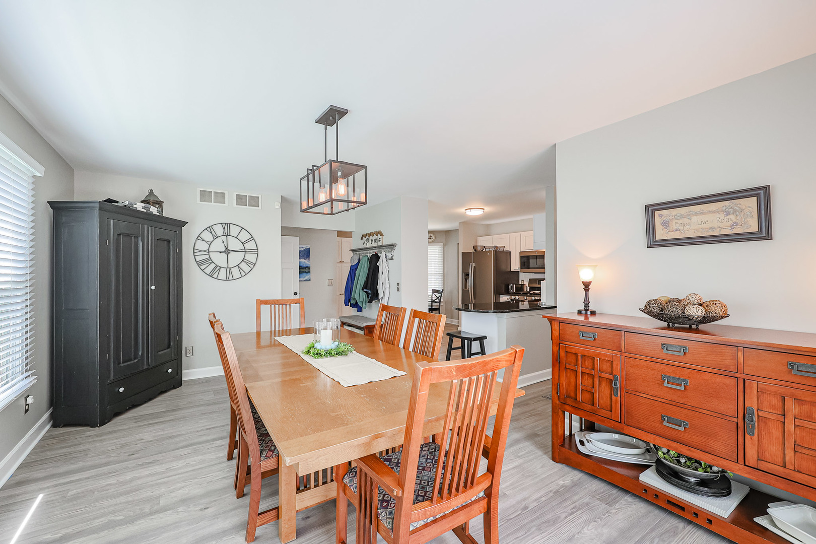 135 Cinderford Drive Oswego, IL 60543 - Photo 11 of 32 a view of a dining room with furniture and wooden floor