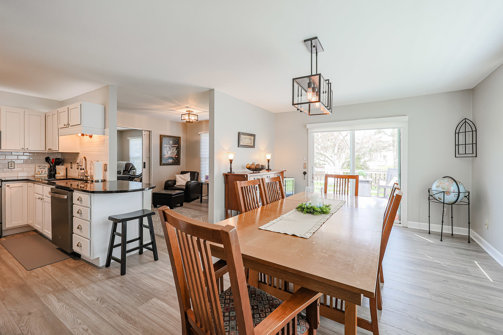 135 Cinderford Drive Oswego, IL 60543 - Photo 12 of 32 a view of a dining room with furniture window and wooden floor