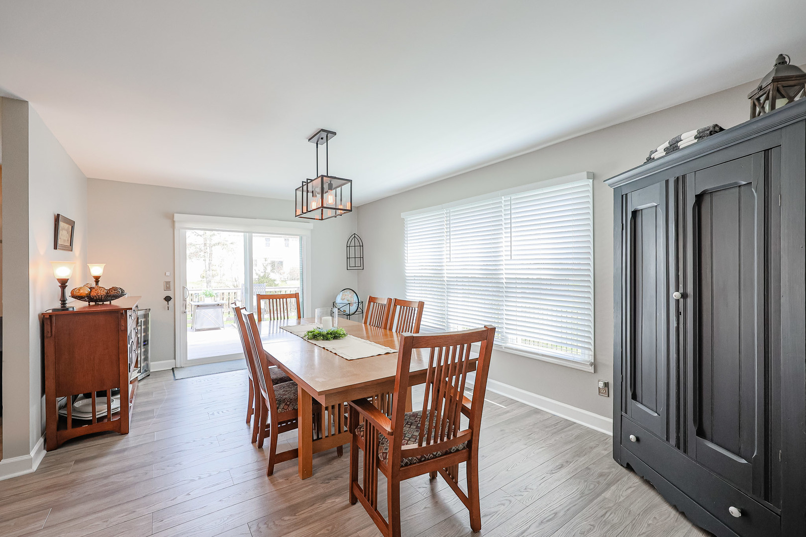 135 Cinderford Drive Oswego, IL 60543 - Photo 13 of 32 a view of a dining room with furniture window and wooden floor