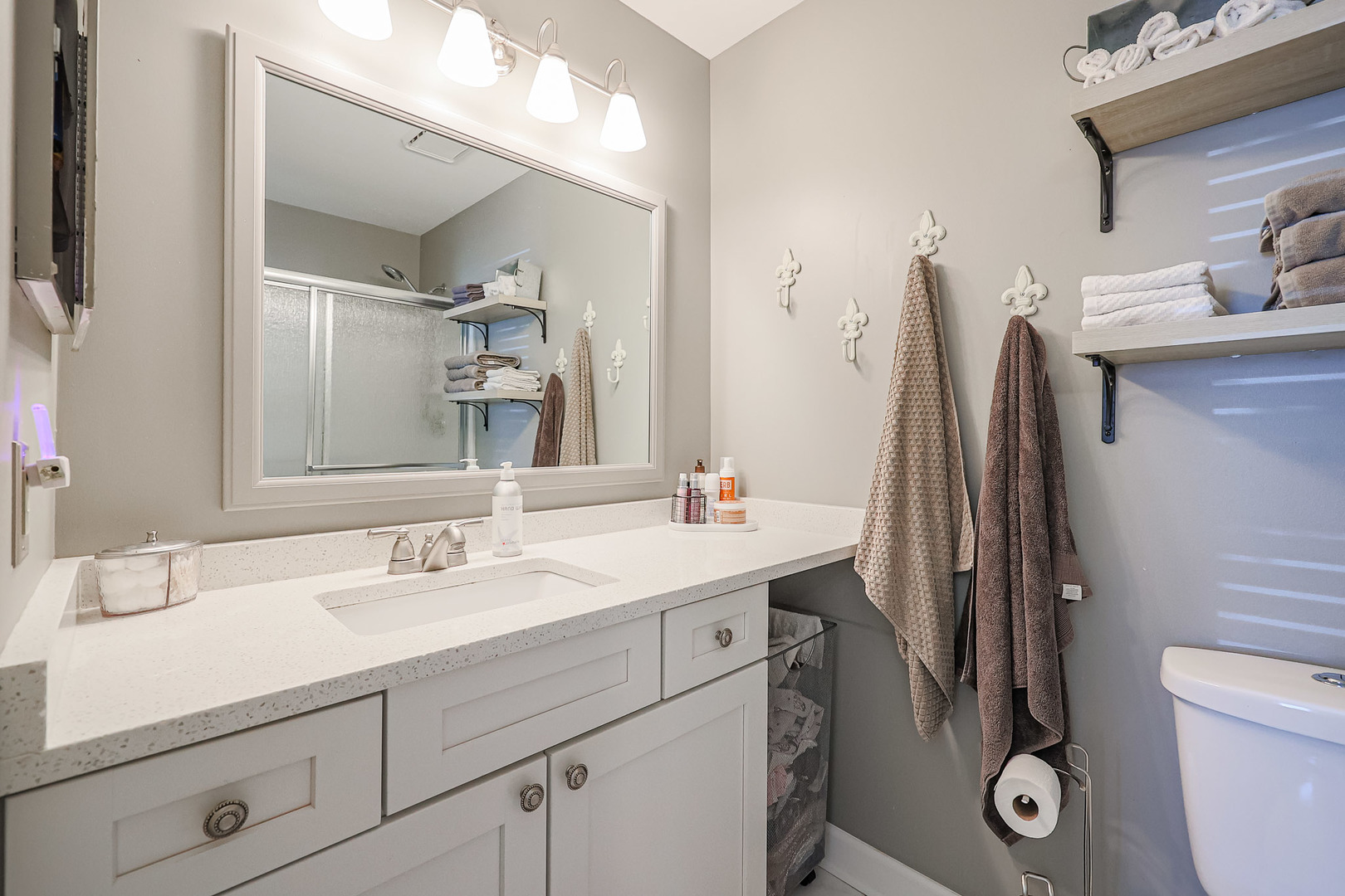 135 Cinderford Drive Oswego, IL 60543 - Photo 18 of 32 a bathroom with a toilet sink and mirror