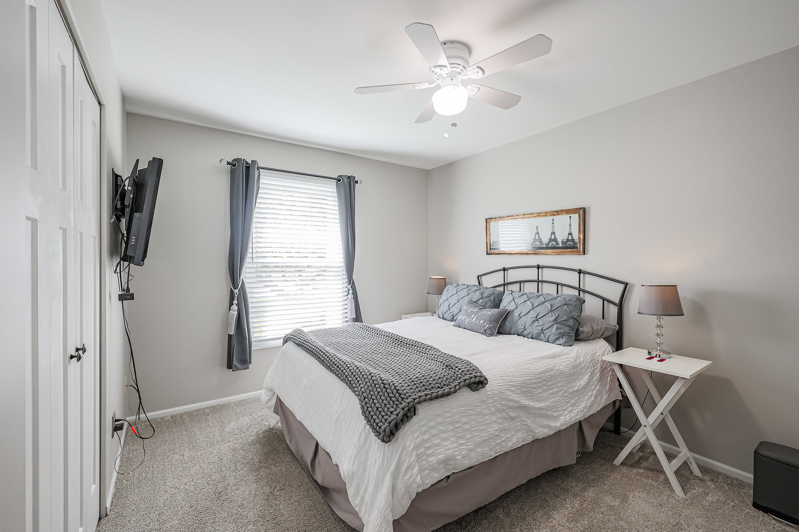 135 Cinderford Drive Oswego, IL 60543 - Photo 19 of 32 a bedroom with a large bed and a chandelier