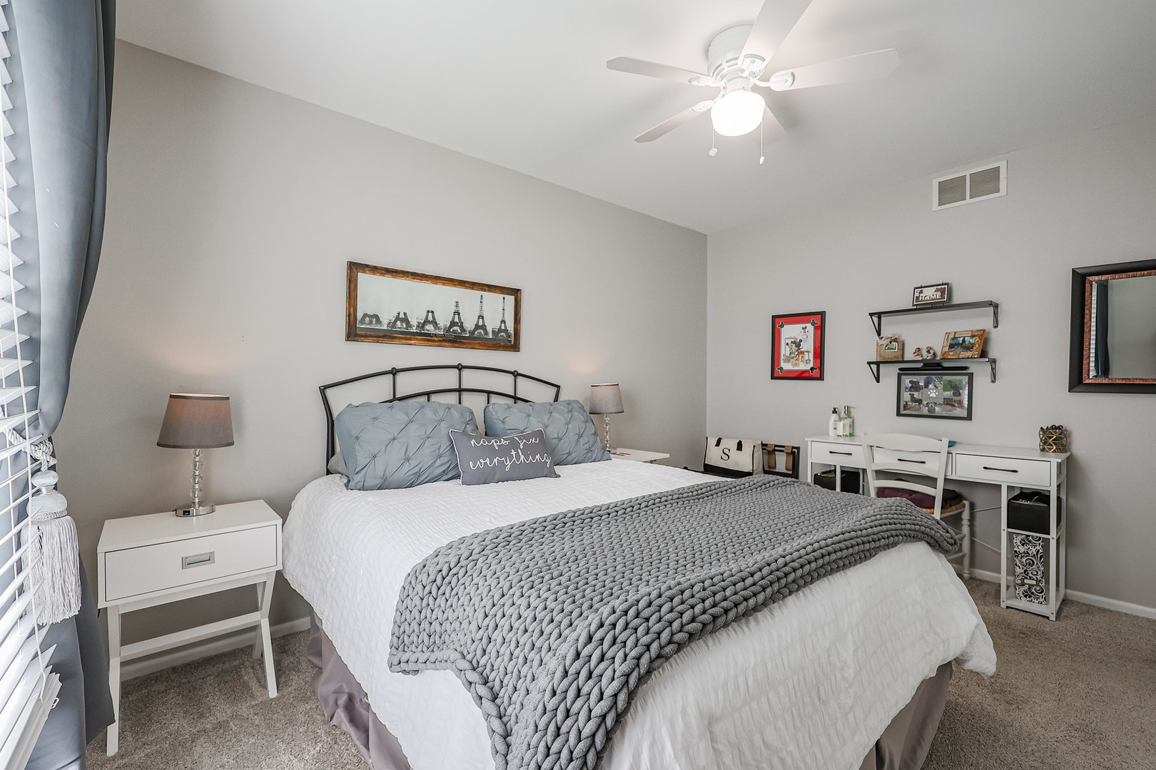 135 Cinderford Drive Oswego, IL 60543 - Photo 20 of 32 a bedroom with a bed and a chandelier