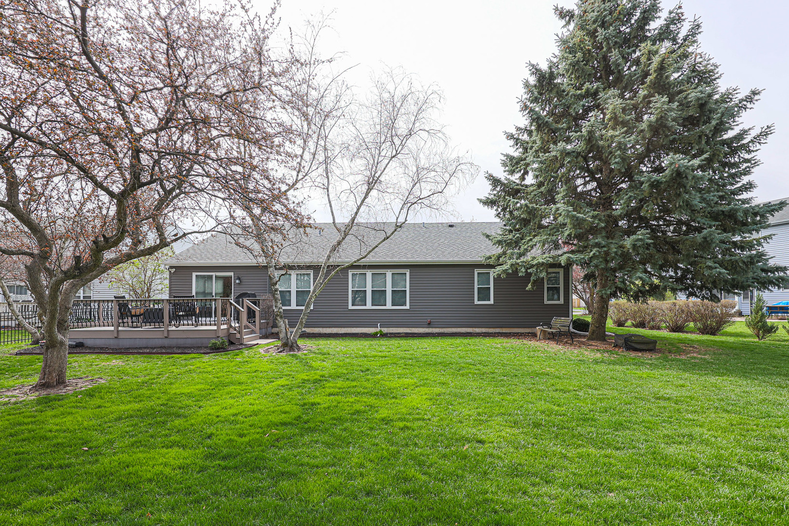 135 Cinderford Drive Oswego, IL 60543 - Photo 29 of 32 a front view of a house with garden