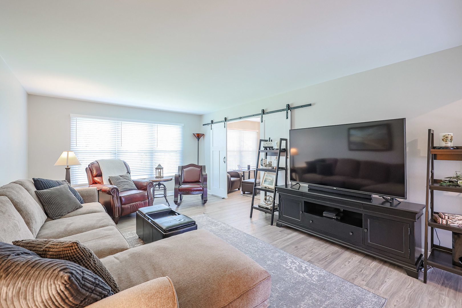 135 Cinderford Drive Oswego, IL 60543 - Photo 5 of 32 a living room with furniture and a flat screen tv
