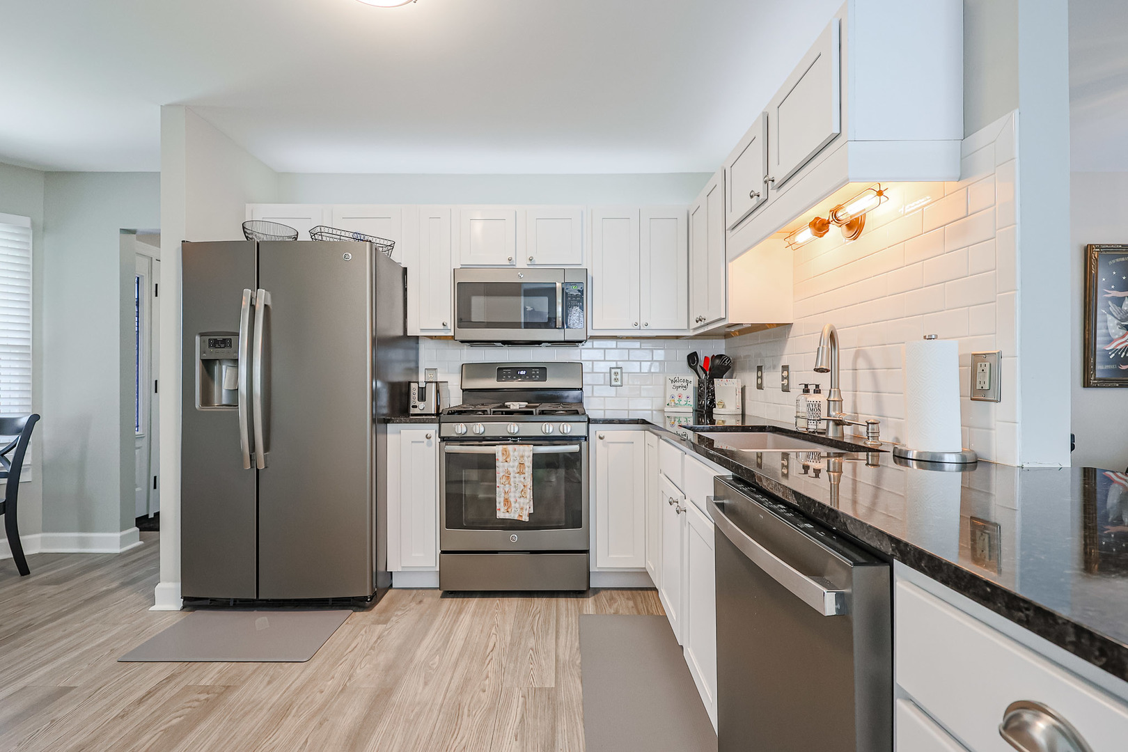 135 Cinderford Drive Oswego, IL 60543 - Photo 7 of 32 a kitchen with a refrigerator a sink and a stove