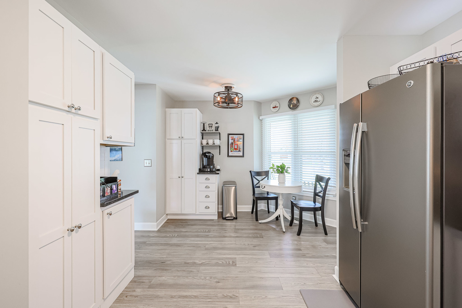 135 Cinderford Drive Oswego, IL 60543 - Photo 9 of 32 a kitchen with stainless steel appliances granite countertop a refrigerator and a stove top oven