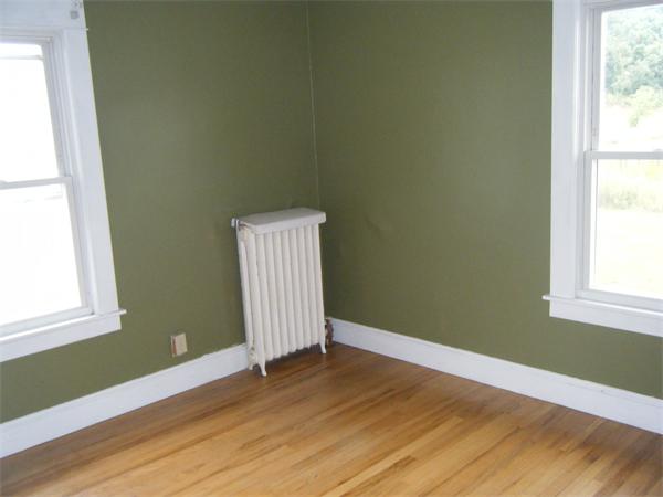 3 Bethany Road Monson, MA 01057 - Photo 14 of 16 a view of an empty room with wooden floor and a window