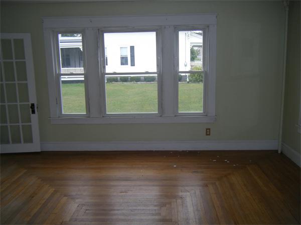 3 Bethany Road Monson, MA 01057 - Photo 6 of 16 a view of an empty room with wooden floor and a window