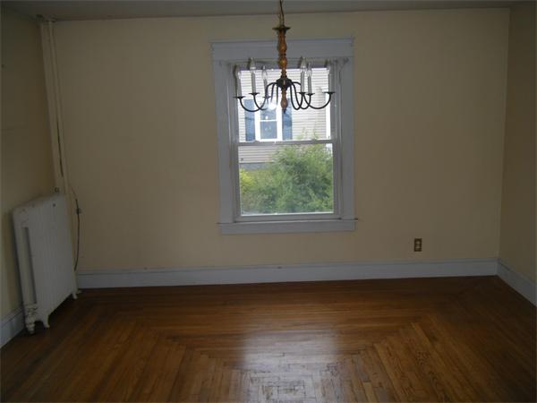 3 Bethany Road Monson, MA 01057 - Photo 7 of 16 an empty room with wooden floor and windows