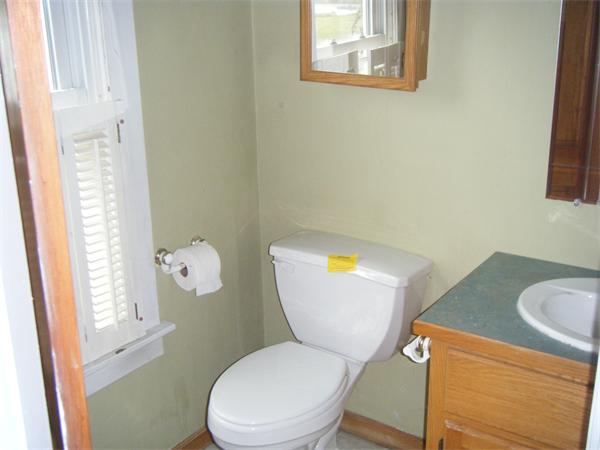 3 Bethany Road Monson, MA 01057 - Photo 9 of 16 a white toilet sitting next to a bathroom sink