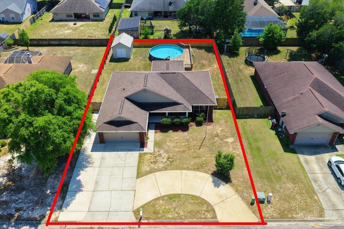 4015 Berry Circle Pace, FL 32571 - Photo 45 of 48 an aerial view of a house with swimming pool