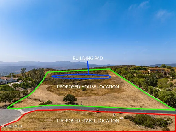 a view of a street with a building in the background