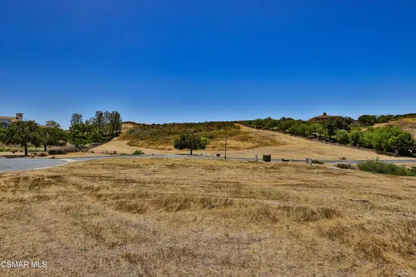 a view of an ocean beach and mountain