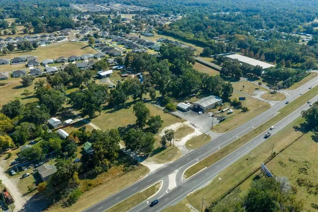 a view of a swimming pool with a yard