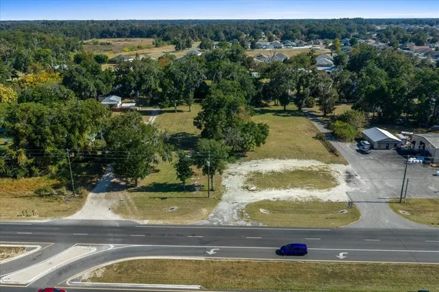 a view of a swimming pool with a yard