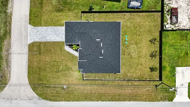 a view of a pool with a yard