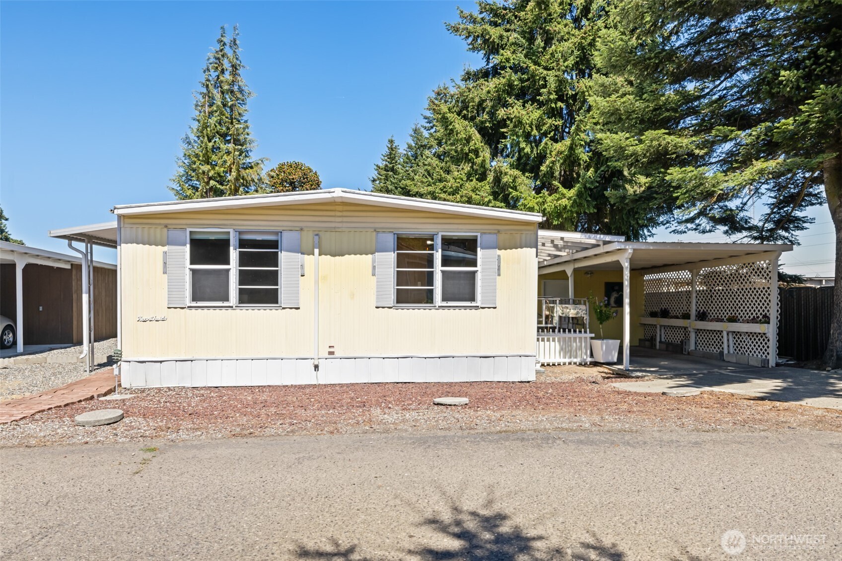 921 South 3rd Avenue, Unit 20 Sequim, WA 98382 - Photo 16 of 37 a front view of a house with a garden