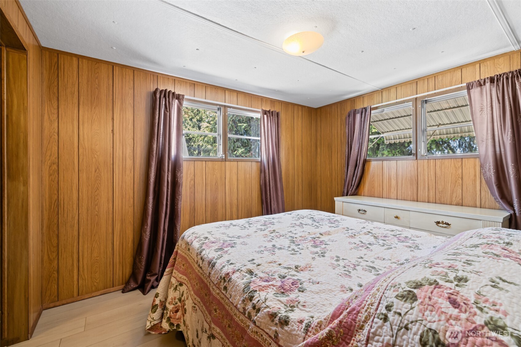 921 South 3rd Avenue, Unit 20 Sequim, WA 98382 - Photo 17 of 37 a bedroom with a bed and a window