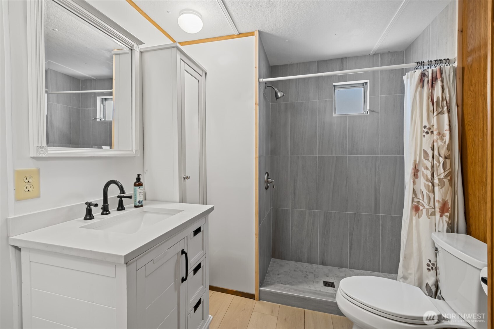 921 South 3rd Avenue, Unit 20 Sequim, WA 98382 - Photo 20 of 37 a bathroom with a sink a toilet and shower