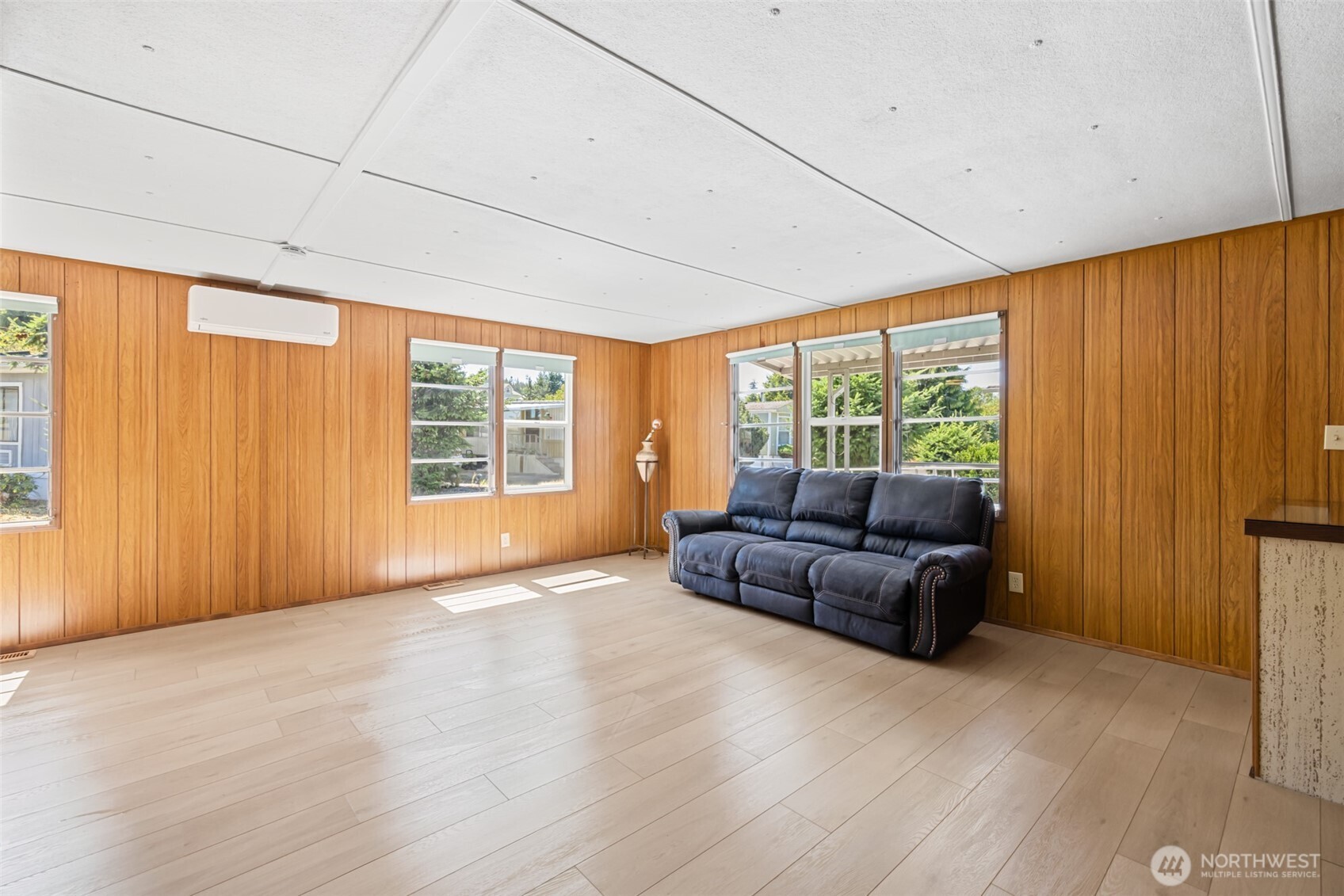 921 South 3rd Avenue, Unit 20 Sequim, WA 98382 - Photo 23 of 37 a living room with furniture and large windows