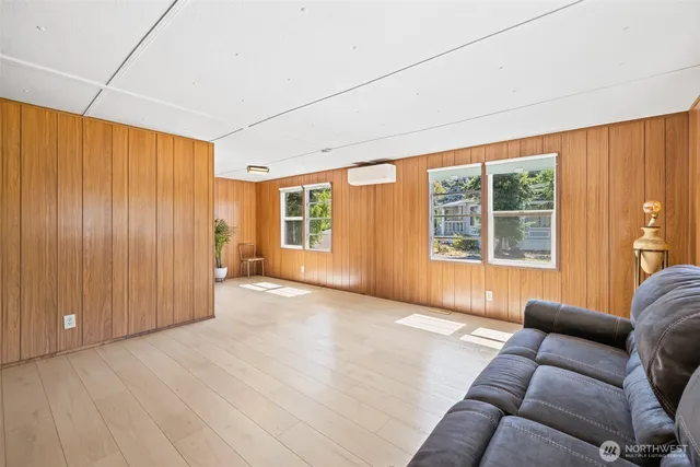 a view of entryway with wooden floor and door