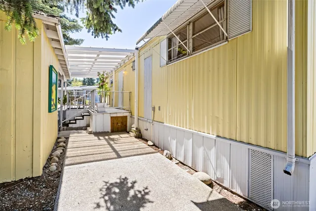 a view of a balcony with wooden floor and door