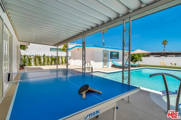 a view of a backyard with a patio