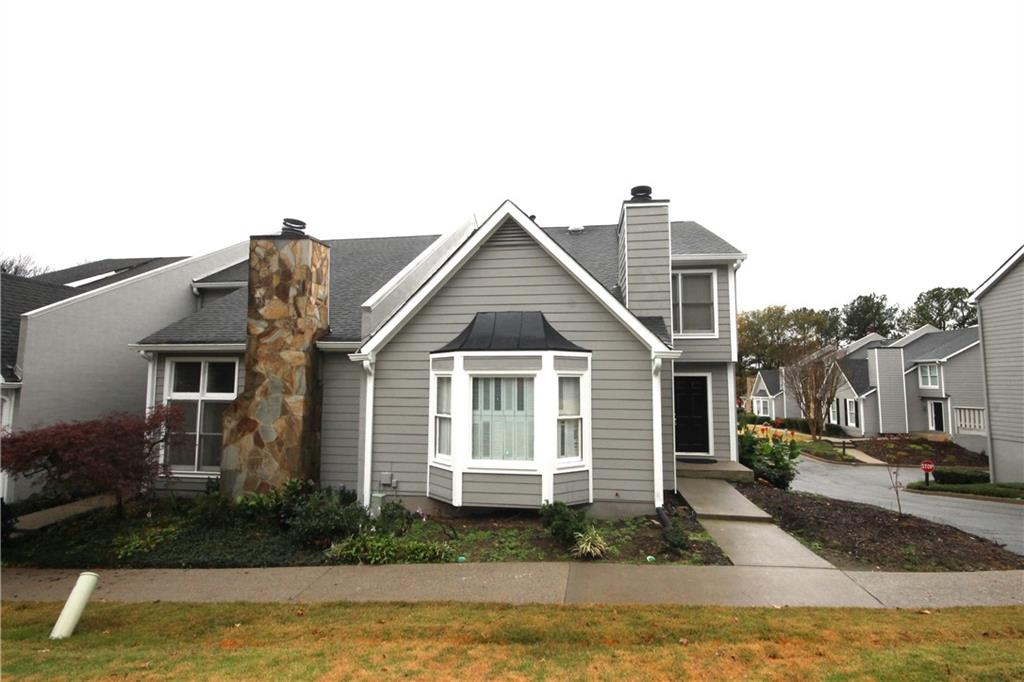 1248 Defoor Court Northwest, Unit 7A Atlanta, GA 30318 - Photo 1 of 1 a front view of a house with a yard