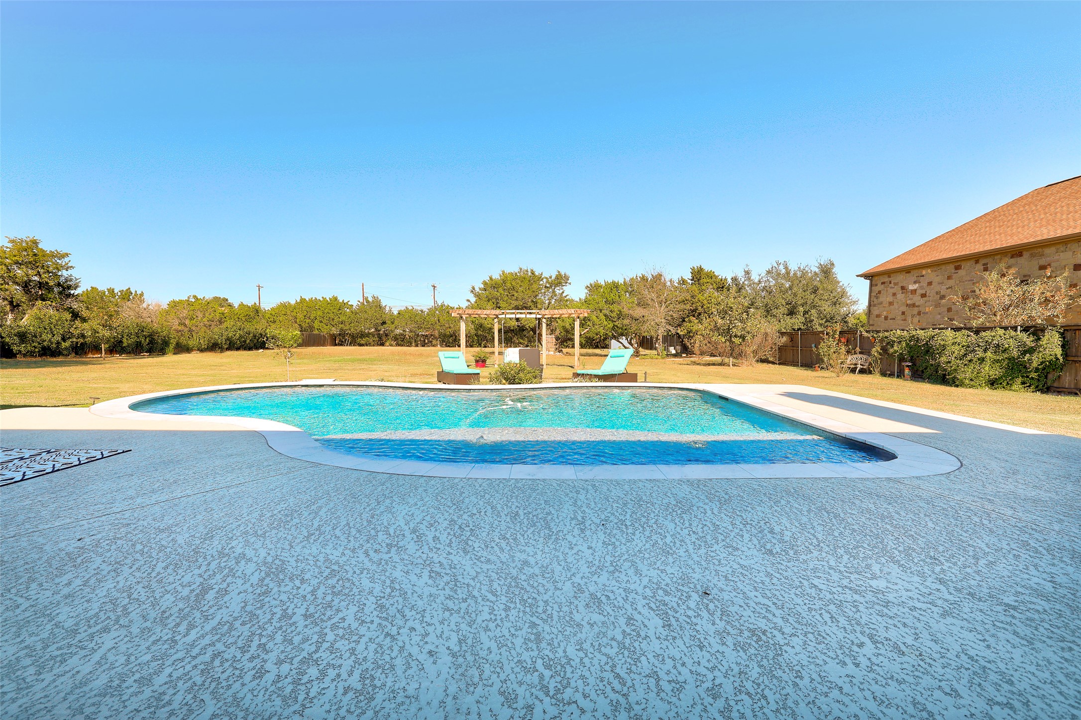 Undisclosed Address Georgetown, TX 78633 - Photo 2 of 39 a view of a golf course with a lake