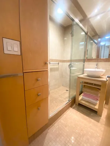 a bathroom with a tub and a shower