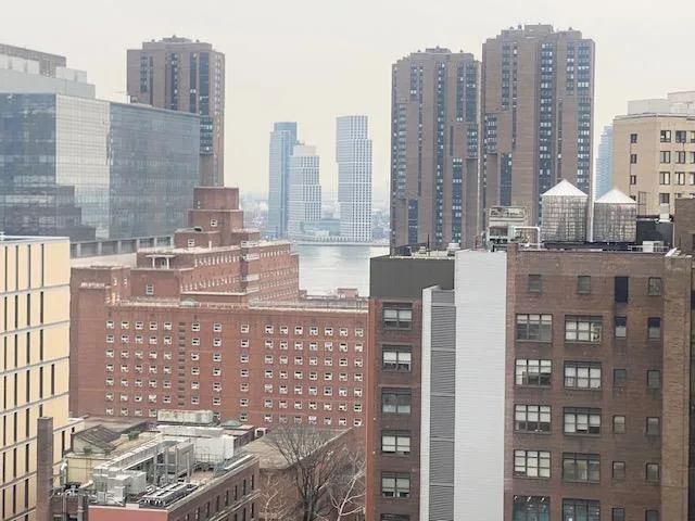 a view of city with tall buildings
