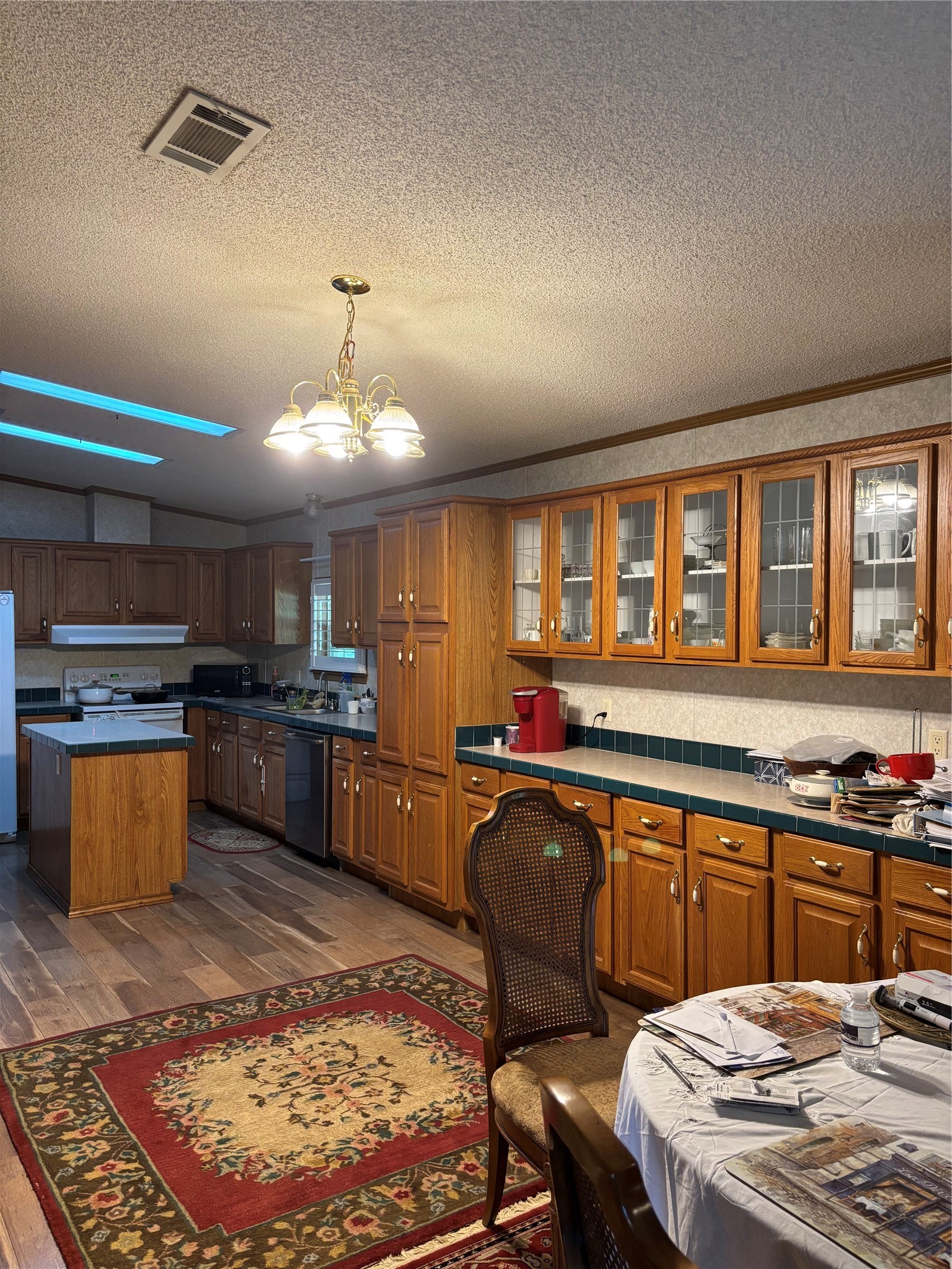 35599 State Highway South Buna, TX 77612 - Photo 23 of 40 a kitchen with a stove a sink and a refrigerator
