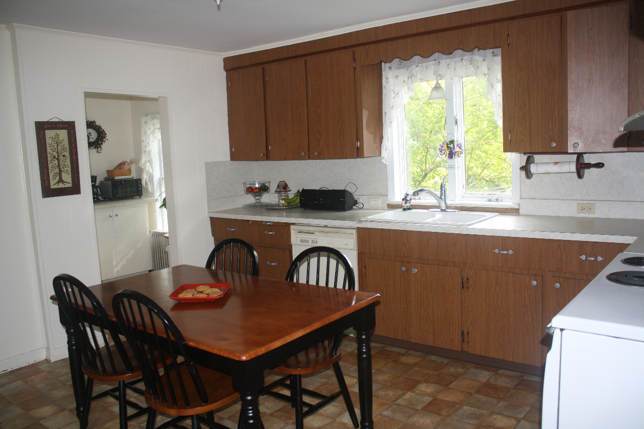 13 Glendale Road Stockbridge, MA 01262 - Photo 4 of 10 a kitchen with a table chairs and a window