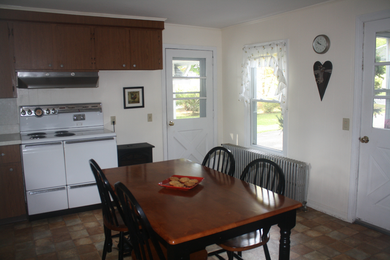 13 Glendale Road Stockbridge, MA 01262 - Photo 5 of 10 a view of a dining room and livingroom with furniture window and wooden floor