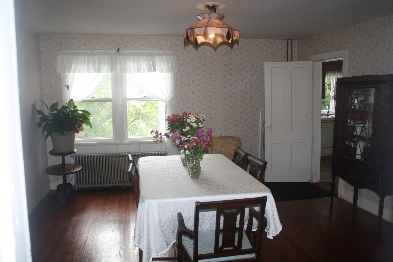 13 Glendale Road Stockbridge, MA 01262 - Photo 7 of 10 a dining room with furniture a chandelier and wooden floor