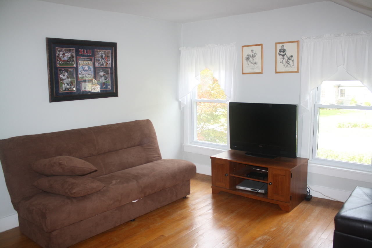 13 Glendale Road Stockbridge, MA 01262 - Photo 9 of 10 a living room with furniture and a flat screen tv