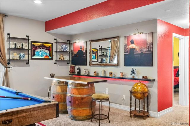 a living room with furniture and flat screen tv