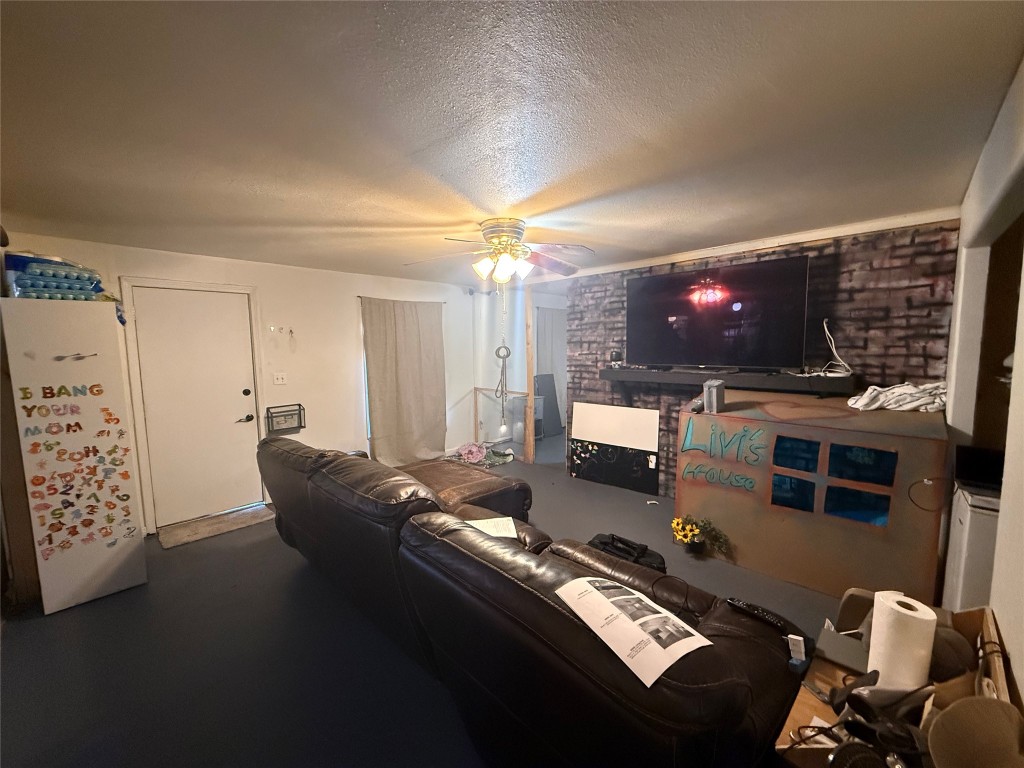 508 North Boundary Street Burnet, TX 78611 - Photo 3 of 20 a living room with furniture and a flat screen tv