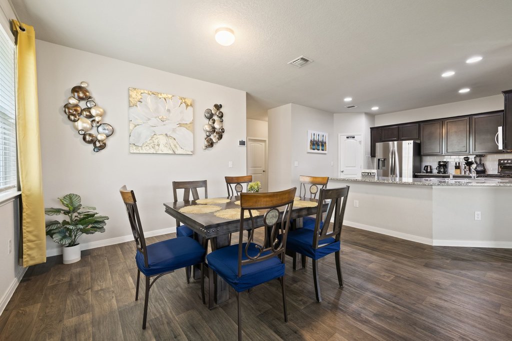 204 Rochester Lane Hutto, TX 78634 - Photo 14 of 40 Dining space featuring dark wood-type flooring and recessed lighting