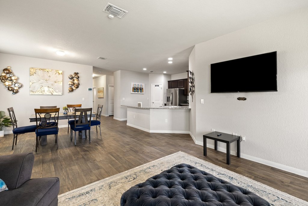 204 Rochester Lane Hutto, TX 78634 - Photo 18 of 40 Living area with baseboards and dark wood-type flooring