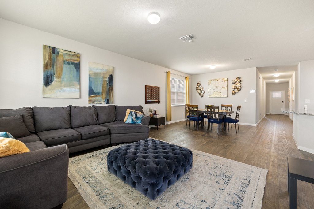 204 Rochester Lane Hutto, TX 78634 - Photo 20 of 40 Living area featuring dark wood-style flooring