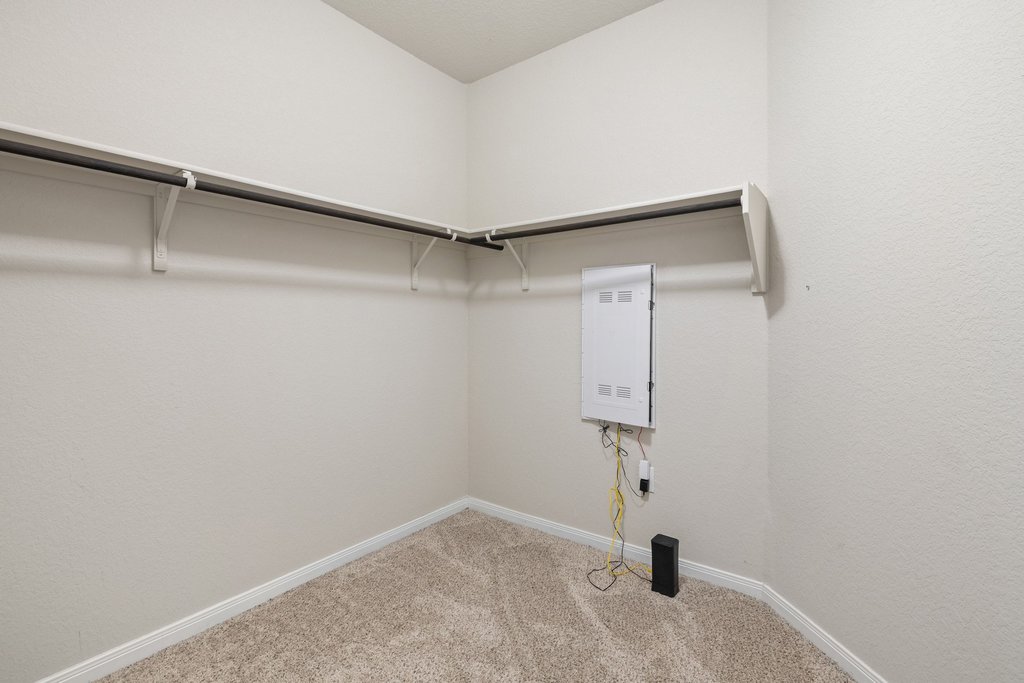 204 Rochester Lane Hutto, TX 78634 - Photo 26 of 40 Walk in closet featuring light colored carpet