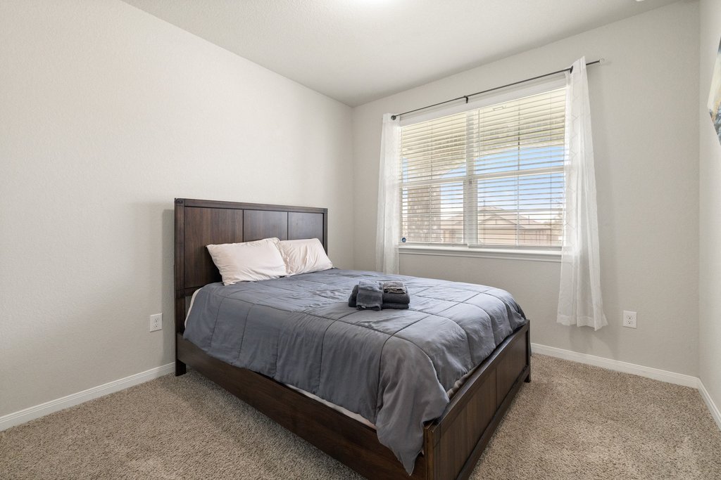 204 Rochester Lane Hutto, TX 78634 - Photo 28 of 40 Bedroom with light carpet